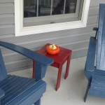accent table and adirondack chairs on my front porch